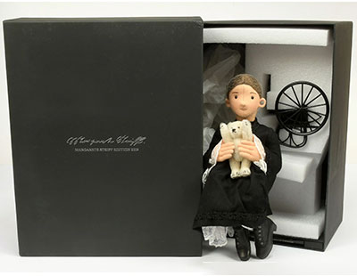 Steiff Margarete felt doll holding a miniature Steiff white mohair teddy bear