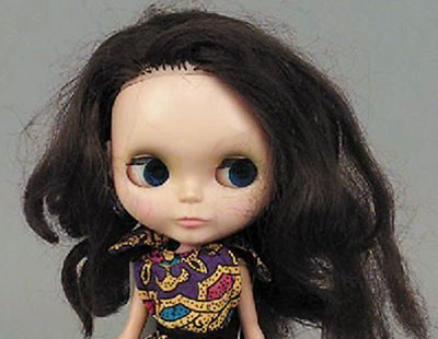 A Blythe doll, 1970s with pull mechanism and pink ring, making the eyes blink