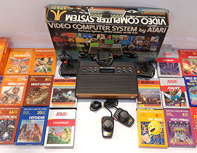 A boxed Atari CX2600 Video Computer System with a Collection of Video Games
